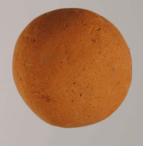 This clay ball found in Minoan ruins is possibly a marble.